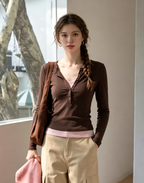Brown Henley-style long-sleeved top
