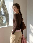 Brown Henley-style long-sleeved top